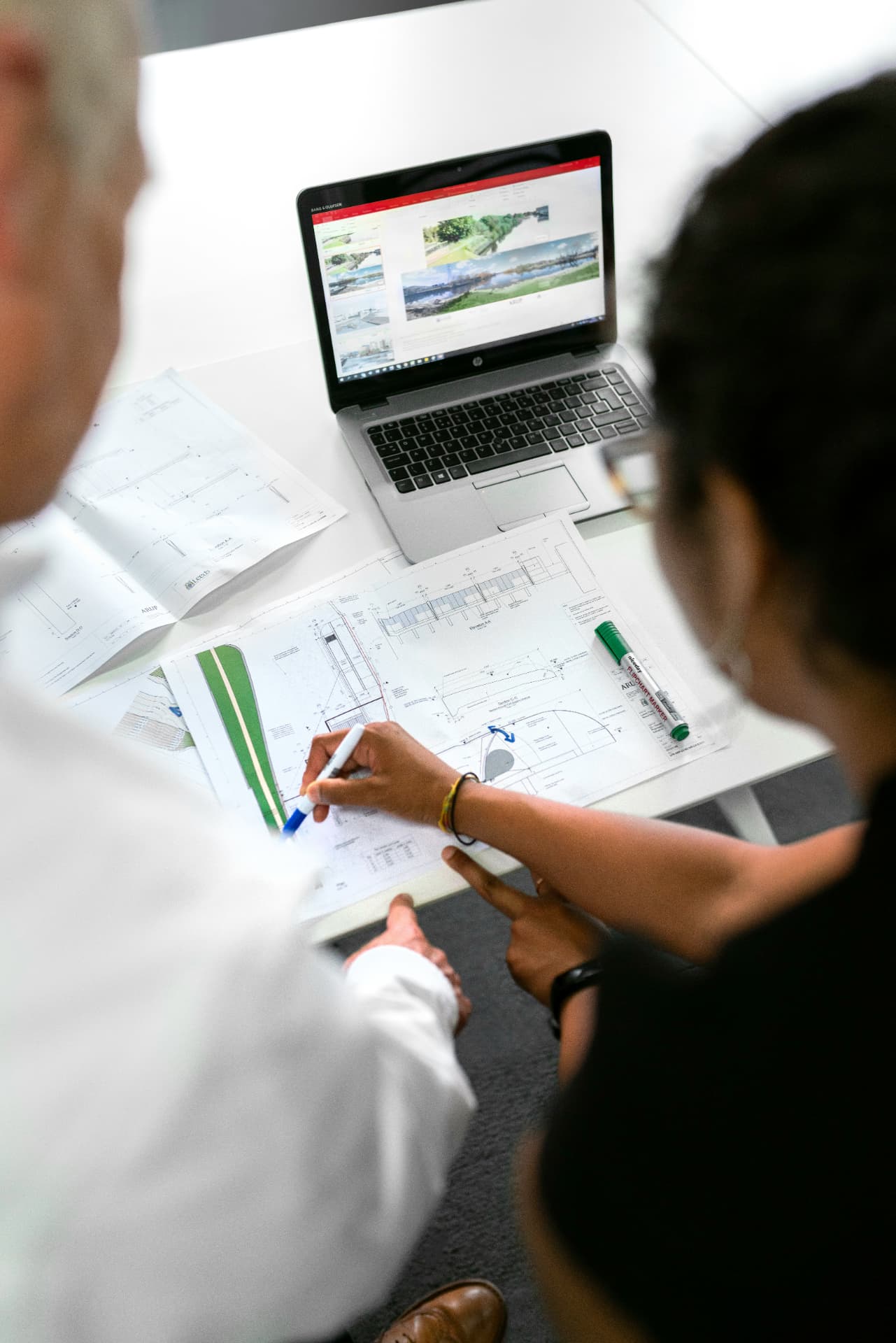 Engineers reviewing site plans together