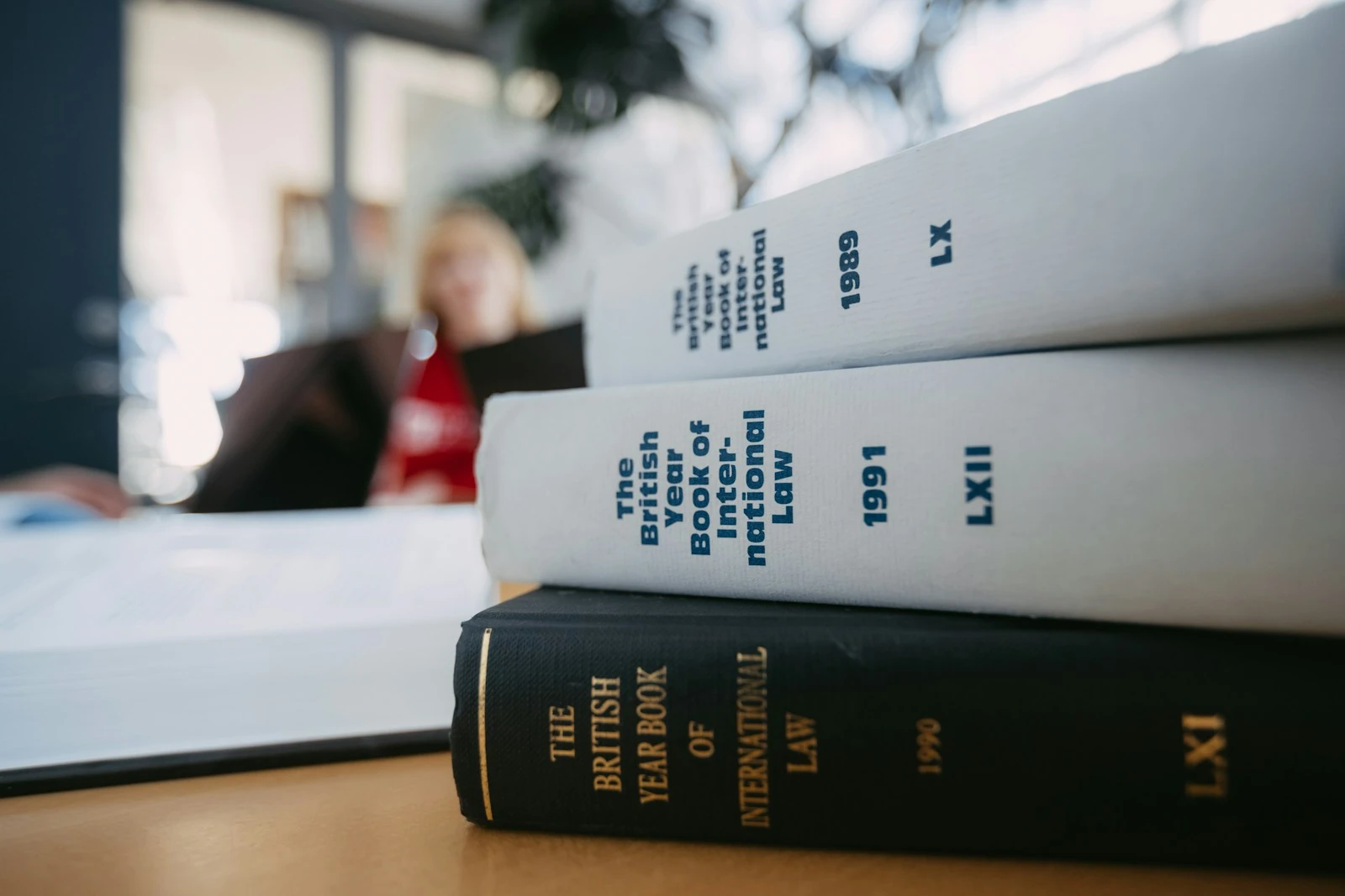 Legal reference books stacked on a desk